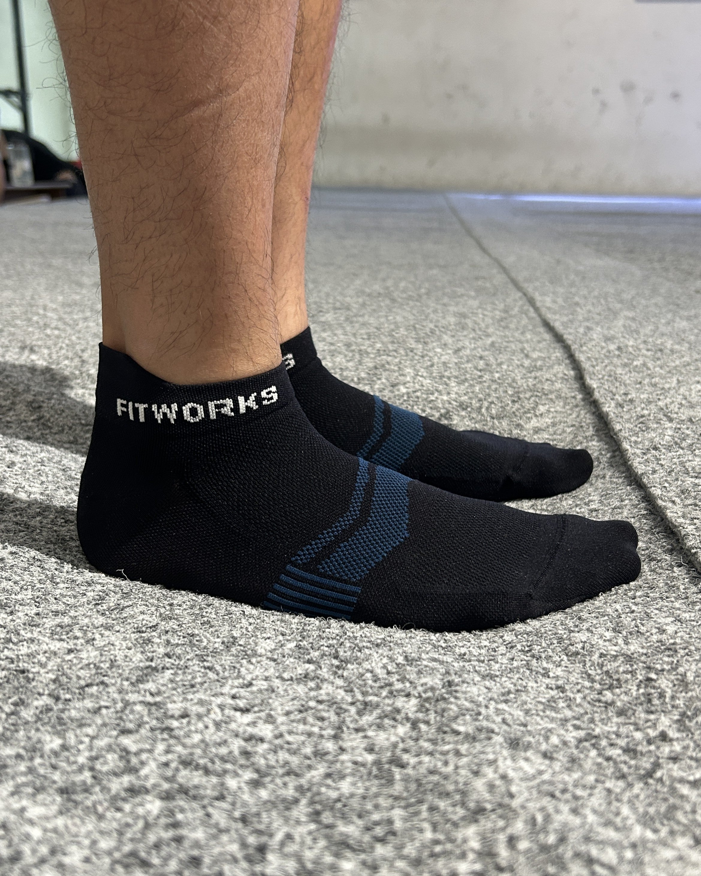 FITWORKS size L socks worn by an EU42 model